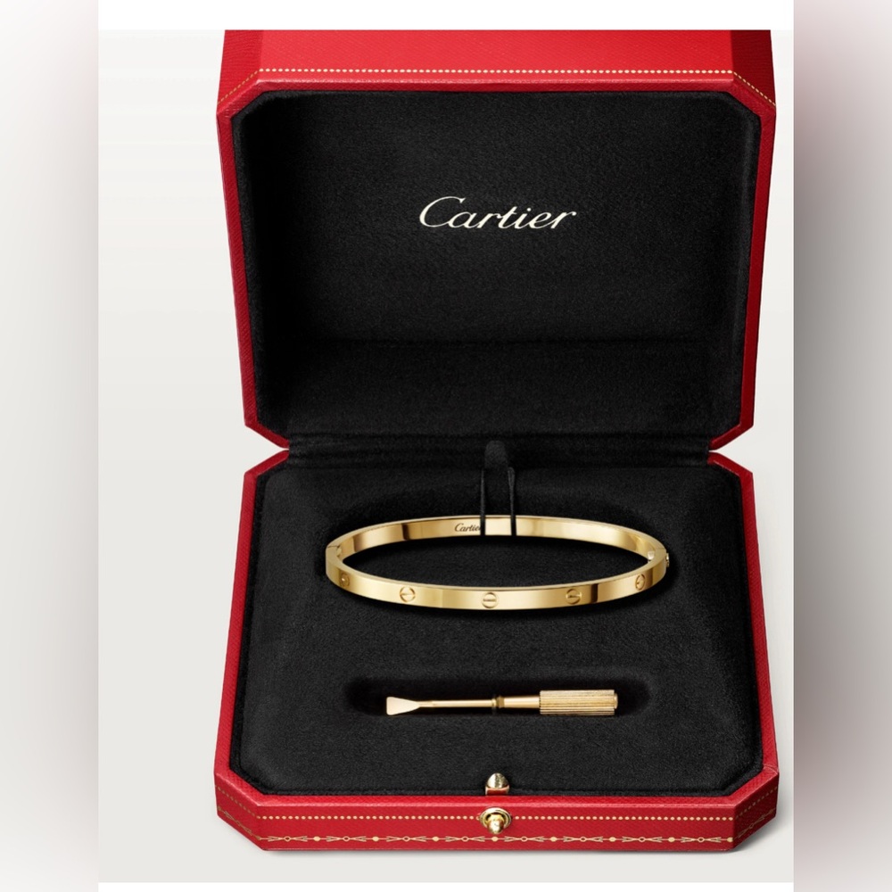 Authentic Cartier love bracelet small model.  18K yellow gold size 17.